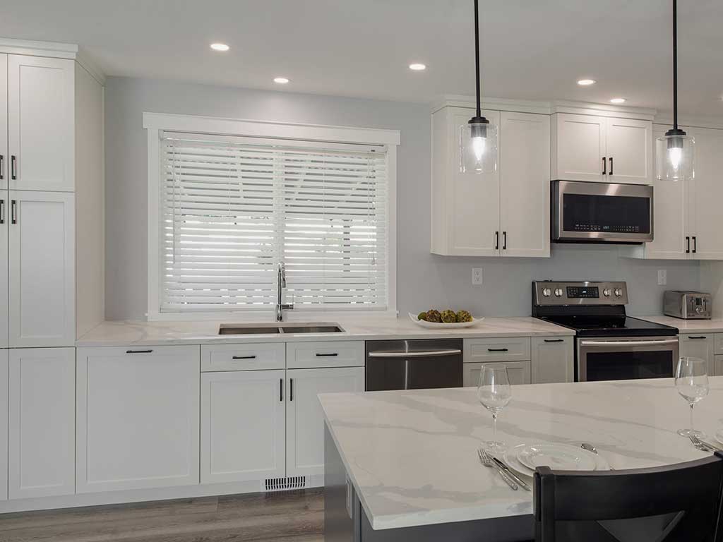 casual kitchen design in white - Kamloops Kitchen Studio